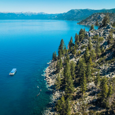 a body of water with a mountain in the background